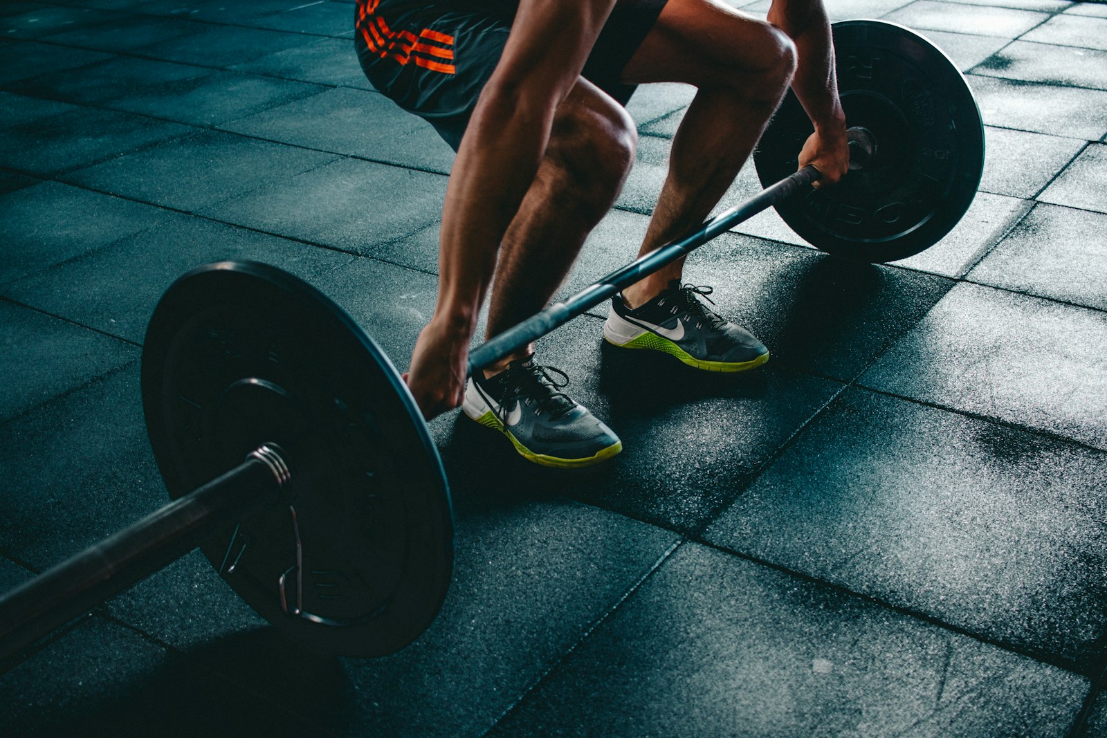 Athlete training with a barbell in a gym