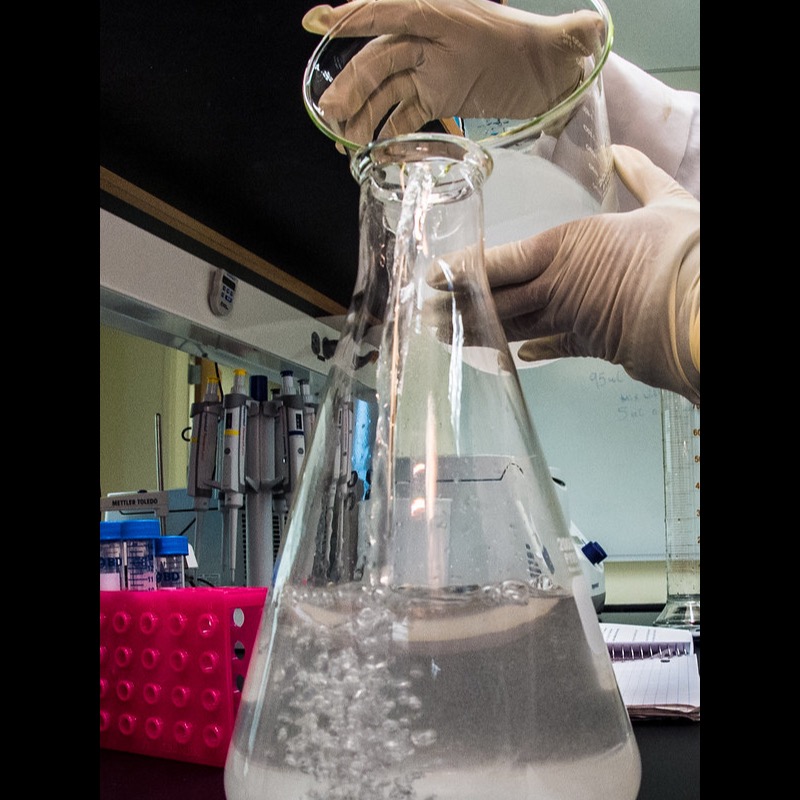 Laboratory glassware; liquid poured into an Erlenmeyer flask