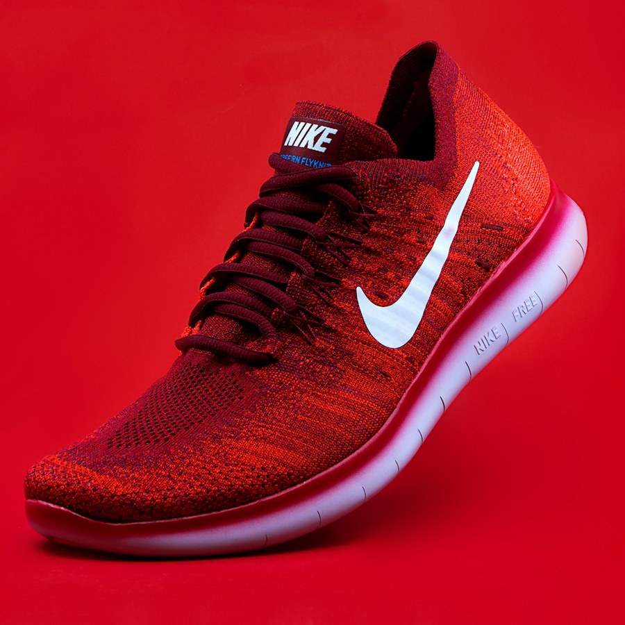 Athletic running shoe on a solid background