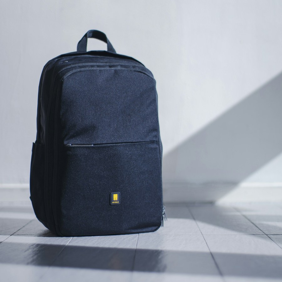 Gym backpack on a light floor; bag for clothes and layers